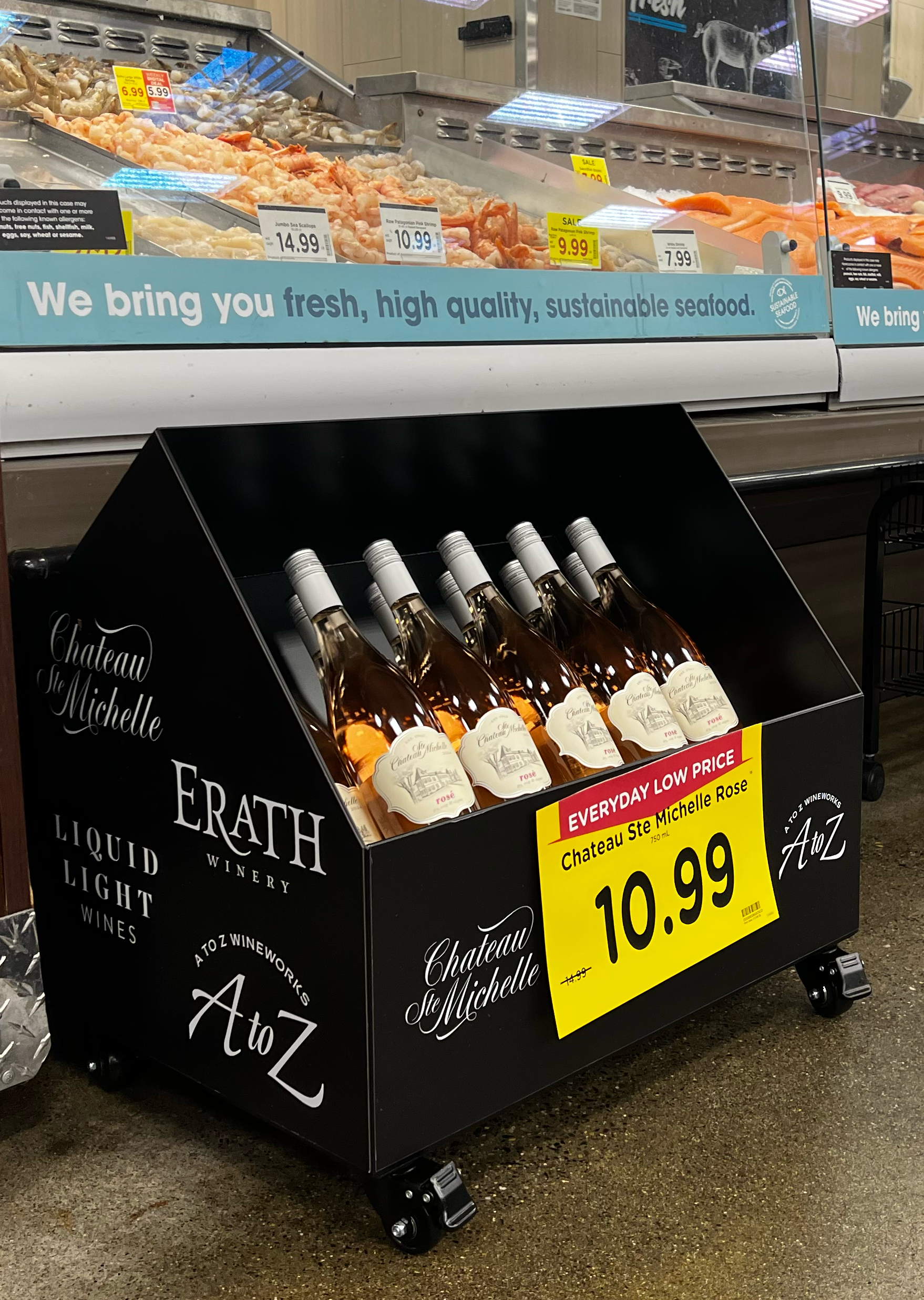 Ste. Michelle wine display installed in-market beneath a Kroger seafood counter